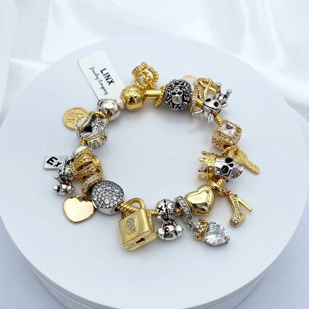 Linx Yellow Gold Snake Chain Bracelet with Skull Themed Charms